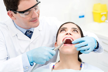 Naklejka premium Teeth whitening at dental office