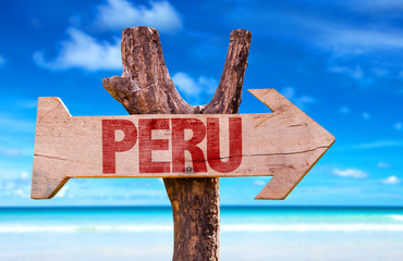 Peru wooden sign with beach background