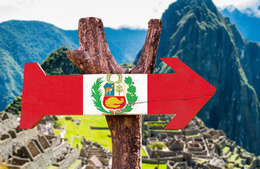 Peru Flag wooden sign with Machu Picchu background
