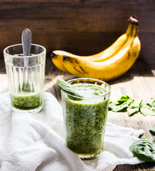 fresh, green smoothie with spinach, banana in a glass, healthy b