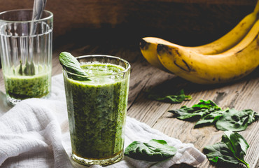 green smoothie with spinach leaves, banana with peanut milk in a
