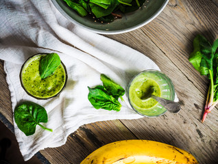 green smoothie with spinach leaves, banana with peanut milk, top
