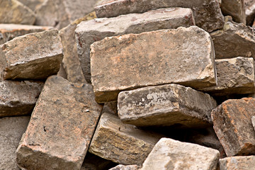 Pile of Old Used Bricks as Construction Material