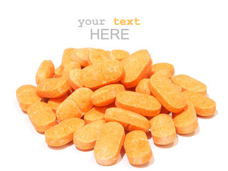 Pills of vitamin C on white background