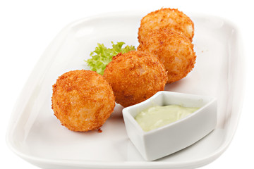 Deep fried cheese balls with  lettuce and white sauce