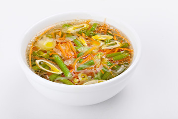 Fresh vegetable soup made of green bean, carrot, potato and leek