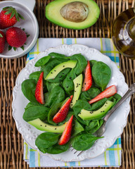 Diet salad of spinach, strawberries and avocado