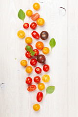 Fototapeta na wymiar Colorful cherry tomatoes and basil