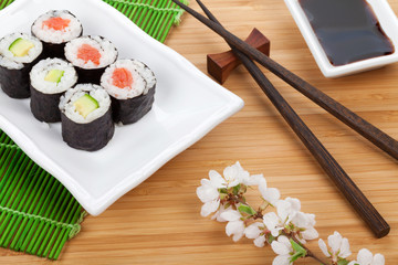 Sushi maki set and sakura branch