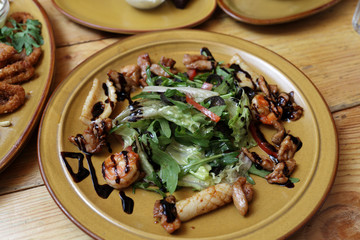 Salad with quid on the plate