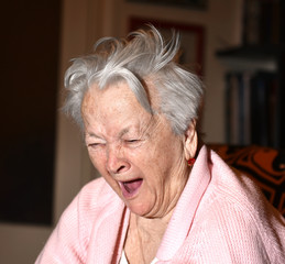 Old woman yawning