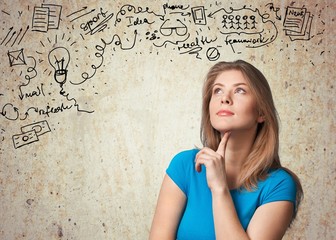 Fototapeta premium Question. Beautiful girl with questions thinks above her head