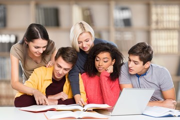 Students. Group of college students at the library