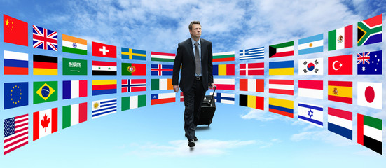 international businessman travel on background of flags