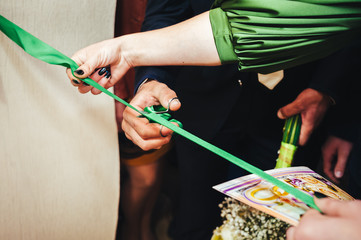 Scissors cut green silk ribbon
