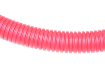 Red plastic corrugated pipe on white background