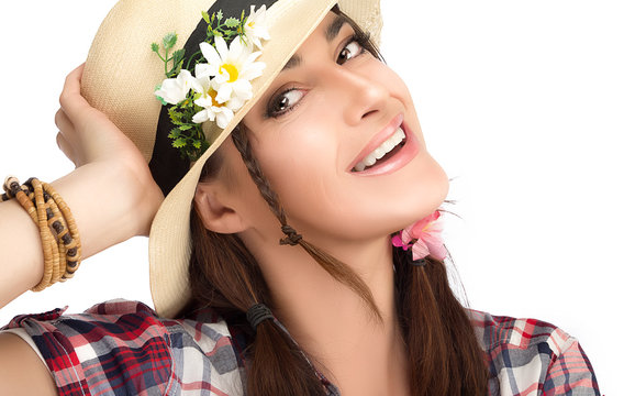 Happy Fashionable Woman Wearing a Hat with Flowers