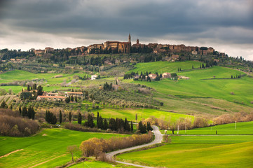 Fototapeta na wymiar Town situated on a hill in the setting sun of Tuscany, Pienza