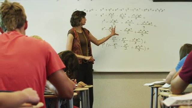 MS DS Teacher talking to students during classes / Spanish Fork City, Utah, USA