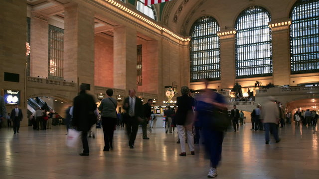 People moving through a train station