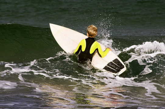 boy surfer waiting for the waves on Sabon beach Corunna Spain