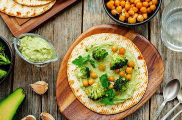 vegan tortilla with roasted broccoli and chickpeas and avocado s