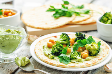 vegan tortilla with roasted broccoli and chickpeas and avocado s