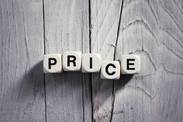 Price. Blocks on wooden background. Vintage style.