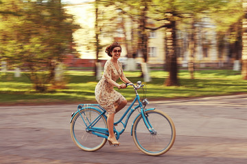 Fototapeta premium girl on a bicycle spring morning