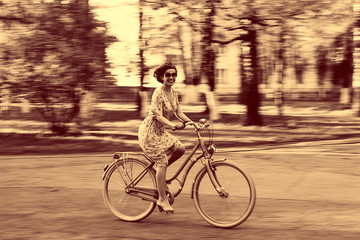 Fototapeta premium girl on bike sunset summer sun