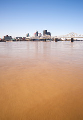Fototapeta premium Muddy Ohio River After Flooding Vertical Skyline Louisville Kent