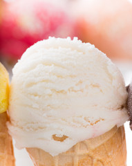 Ice cream scoops on wooden table.