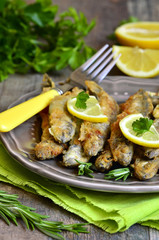 Fried capelin with lemon and herbs.