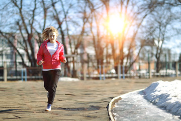 young athletic girl on a walk in the park