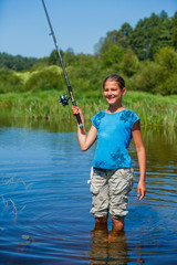 Girl fishing on the river.