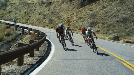 cyclists riding downhill