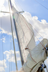 Obraz premium Closeup View of Mid-Size Yacht Mast and Canvas Sail Shot Against