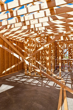 An interior view of a new home under construction with exposed w