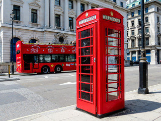 Red phone booth and the red bus on the street of London
