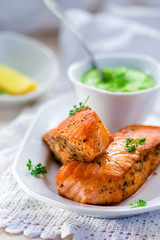 fried fillet of a salmon with green peas sauce