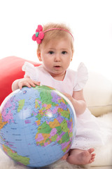Baby girl with globe
