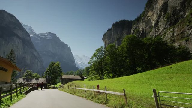 Medium snot of road leading to remote town / Lauterbrunnan, Switzerland