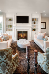 Beautiful living room with fireplace in new luxury home