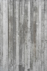 Fototapeta premium texture of wooden formwork stamped on a raw concrete wall as bac