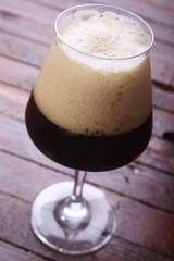 Dark beer on wood