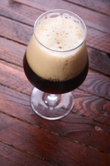 Dark beer on wood