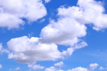 Naklejka na ściany i meble bright white clouds in the blue sky