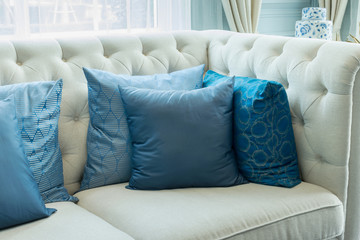 luxury living room interior with blue pattern pillows on sofa