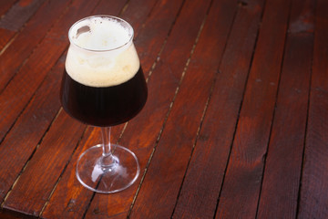 Dark beer on wood