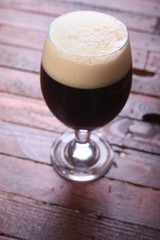 Dark beer on wood